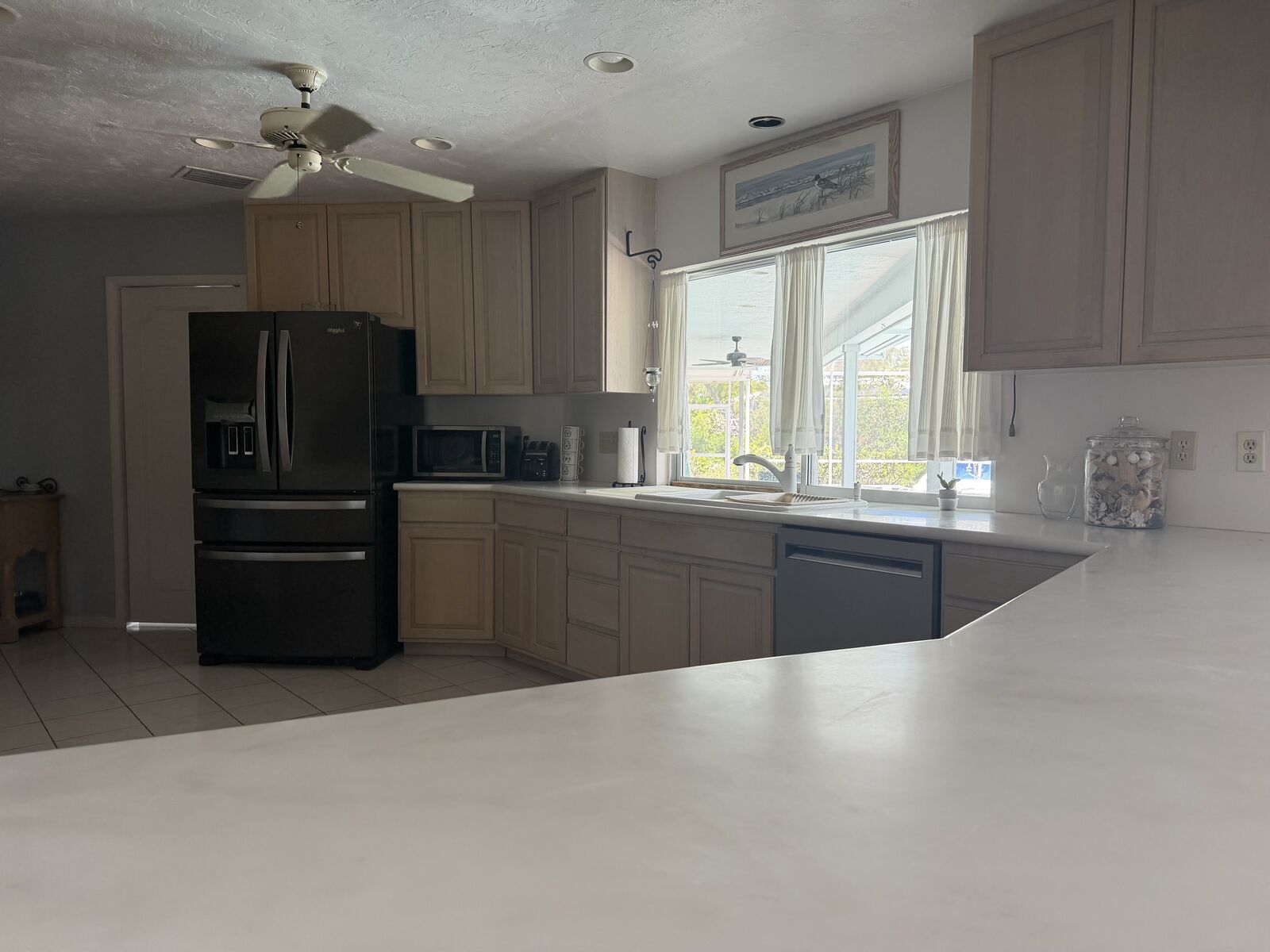 Spacious open kitchen with island and cabinetry