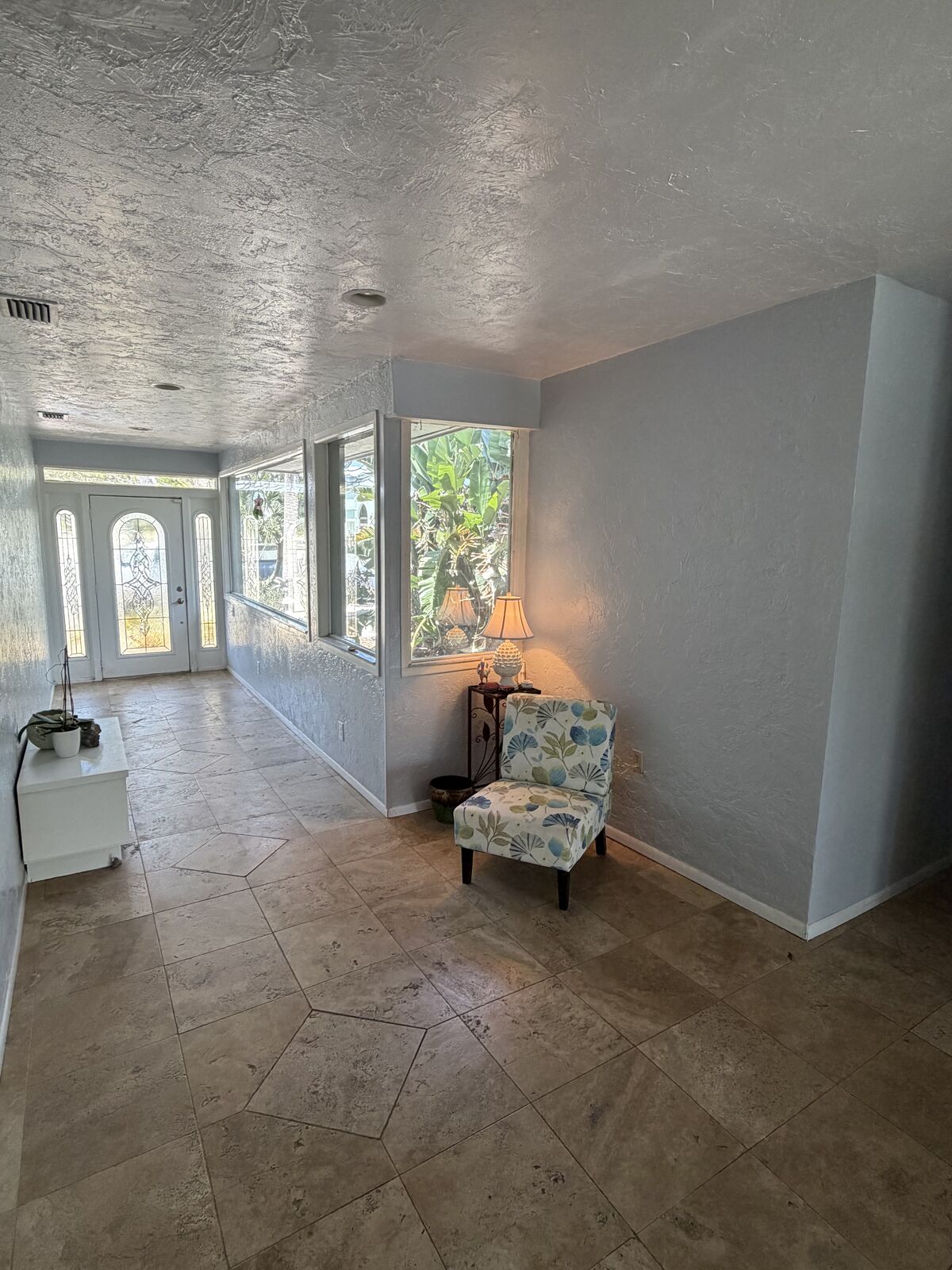 Foyer with custom etched-glass entry doors