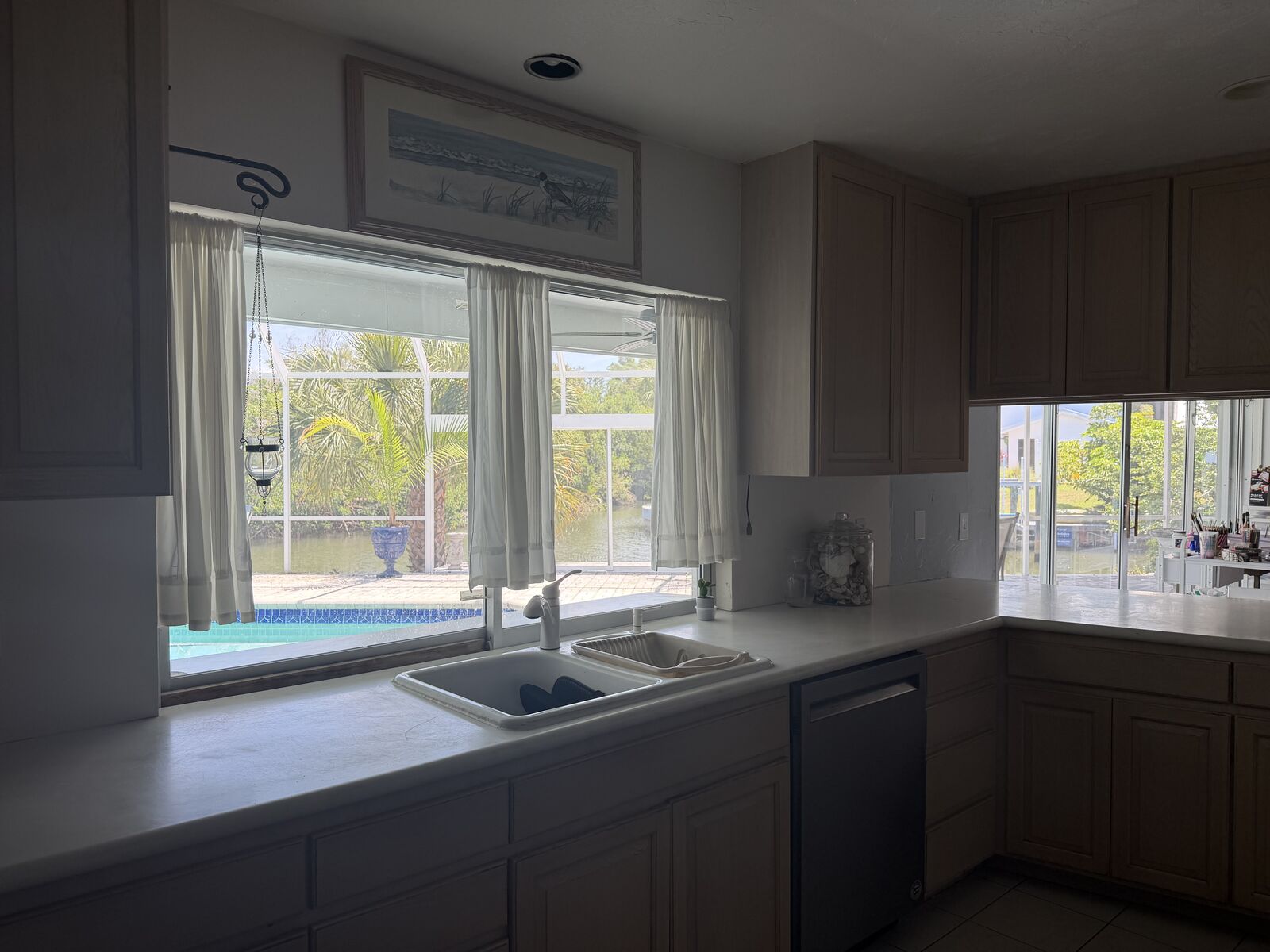 Kitchen window looking out to the pool and lanai